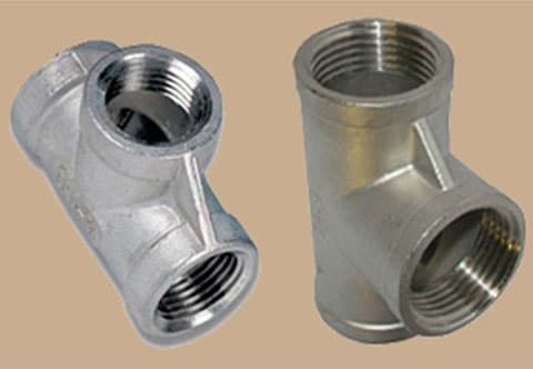 Two stainless steel pipe fittings: one is a threaded elbow, the other is a socket weld tee